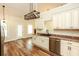 Bright kitchen has stainless dishwasher and wood flooring with an open floorplan at 47 Cliff Ct, Villa Rica, GA 30180