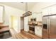 Bright kitchen features stainless steel appliances, pantry, and modern lighting at 47 Cliff Ct, Villa Rica, GA 30180