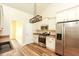 Bright kitchen features stainless steel appliances, pantry, and modern lighting at 47 Cliff Ct, Villa Rica, GA 30180