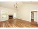Cozy living room has a stone fireplace, hardwood floors, and a vaulted ceiling at 47 Cliff Ct, Villa Rica, GA 30180