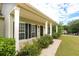 Inviting front porch with white columns and manicured shrubs, creating curb appeal at 47 Cliff Ct, Villa Rica, GA 30180