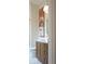 Bathroom featuring wood vanity, oval mirror, modern lighting, and neutral paint at 541 Londonberry Rd, Atlanta, GA 30327