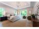 Spacious bedroom with large windows, tray ceilings, and hardwood floors at 541 Londonberry Rd, Atlanta, GA 30327