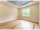 Bedroom featuring hardwood floors, neutral paint, and double-hung windows at 541 Londonberry Rd, Atlanta, GA 30327
