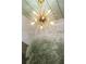 Stylish gold chandelier with unique design and decorative wallpaper at 541 Londonberry Rd, Atlanta, GA 30327
