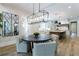 Dining area with view of kitchen and stylish mirror decor at 541 Londonberry Rd, Atlanta, GA 30327