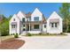 Beautiful exterior of a white brick home, featuring a well manicured lawn and fresh mulch at 541 Londonberry Rd, Atlanta, GA 30327