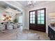 Elegant foyer featuring hardwood floors, stylish decor, and views to the dining room at 541 Londonberry Rd, Atlanta, GA 30327