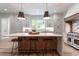 Spacious kitchen with waterfall island, modern appliances and a seamless design at 541 Londonberry Rd, Atlanta, GA 30327