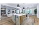 Open-concept kitchen with a marble island, flows into a living room, and has hardwood floors at 541 Londonberry Rd, Atlanta, GA 30327