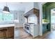 Elegant kitchen with custom cabinetry, a chef's range, and marble countertops at 541 Londonberry Rd, Atlanta, GA 30327