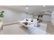 Spacious living room with a neutral color scheme, modern furniture, and recessed lighting at 541 Londonberry Rd, Atlanta, GA 30327
