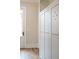 Stylish mudroom with custom white lockers and a rustic hardwood floor, perfect for organization and comfort at 541 Londonberry Rd, Atlanta, GA 30327