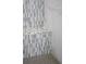 Modern shower with a mosaic-tiled bench and elegant marble wall accents at 541 Londonberry Rd, Atlanta, GA 30327