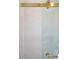 Close up of the shower featuring elegant tiling and gold hardware at 541 Londonberry Rd, Atlanta, GA 30327