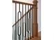 Close up of a staircase featuring a modern design with wood and dark railings at 541 Londonberry Rd, Atlanta, GA 30327