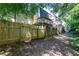 Fenced backyard with a path alongside the property and wooden fences at 6109 Park Ave, Atlanta, GA 30342