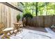 Outdoor seating area with a small table, chairs, and a striped rug on the patio at 6109 Park Ave, Atlanta, GA 30342