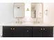 Modern bathroom featuring double sinks, marble countertops, gold fixtures, and a tiled shower at 6109 Park Ave, Atlanta, GA 30342