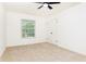 Bright bedroom with neutral carpet, ceiling fan, and closet space near the window at 6109 Park Ave, Atlanta, GA 30342