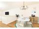 Bright dining area featuring a round table, stylish chandelier, and wood floors at 6109 Park Ave, Atlanta, GA 30342