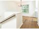 Dining area featuring hardwood floors, natural light, and modern chandelier at 6109 Park Ave, Atlanta, GA 30342