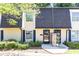 Townhome exterior with well-maintained landscaping and dual front doors at 6109 Park Ave, Atlanta, GA 30342
