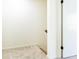 Neutral hallway showcasing carpeted flooring, base trim and a white door at 6109 Park Ave, Atlanta, GA 30342