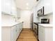 Updated kitchen featuring white cabinets, quartz countertops and stainless steel appliances at 6109 Park Ave, Atlanta, GA 30342