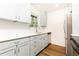 Updated kitchen featuring white cabinets, quartz countertops and stainless steel appliances at 6109 Park Ave, Atlanta, GA 30342