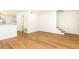 Open-concept living space with hardwood floors, stairs and a view of the kitchen at 6109 Park Ave, Atlanta, GA 30342