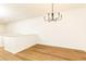 Bright living room featuring hardwood flooring and modern chandelier lighting at 6109 Park Ave, Atlanta, GA 30342