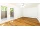 Living room with hardwood floors, ceiling fan, and glass doors opening to the backyard at 6109 Park Ave, Atlanta, GA 30342