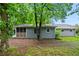 Charming single story home with a screened in porch nestled on a wooded lot at 6549 Biscayne Way, Douglasville, GA 30135