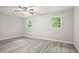 Cozy bedroom featuring sleek floors and windows offering peaceful outdoor views at 6549 Biscayne Way, Douglasville, GA 30135