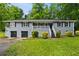 Charming single-story home with a well-maintained lawn and front-facing two-car garage at 6549 Biscayne Way, Douglasville, GA 30135