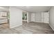 Spacious living area adjacent to the kitchen featuring sleek floors, and glass doors to the outside at 6549 Biscayne Way, Douglasville, GA 30135