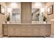 Well-lit bathroom with double vanity, stylish mirrors, and ample storage at 171 Beverly Ne Rd, Atlanta, GA 30309