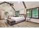 Spacious bedroom features vaulted ceilings, wood-look floors, and large windows for lots of natural light at 171 Beverly Ne Rd, Atlanta, GA 30309