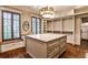 Large walk-in closet with custom shelving, storage island, and natural lighting at 171 Beverly Ne Rd, Atlanta, GA 30309