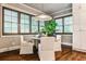 Bright dining area with plantation shutters, stylish lighting, and views to the outside at 171 Beverly Ne Rd, Atlanta, GA 30309