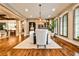 Well-lit dining room featuring wood floors, designer lighting, and convenient access to the kitchen at 171 Beverly Ne Rd, Atlanta, GA 30309