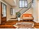 Elegant foyer showcasing wood floors, staircase with iron railing, and a stylish zebra print rug at 171 Beverly Ne Rd, Atlanta, GA 30309