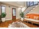 Inviting foyer featuring wood floors, paneled walls, and a staircase with iron railing at 171 Beverly Ne Rd, Atlanta, GA 30309