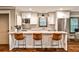 The eat-in kitchen has stainless appliances, white cabinetry, a large island, and a subway tile backsplash at 171 Beverly Ne Rd, Atlanta, GA 30309