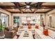 Open-concept living room featuring coffered ceilings and seamless flow into a modern white kitchen at 171 Beverly Ne Rd, Atlanta, GA 30309