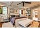 Comfortable main bedroom featuring a ceiling fan and a view into the ensuite bathroom at 171 Beverly Ne Rd, Atlanta, GA 30309