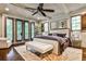 Spacious main bedroom with custom windows, ceiling fan, and a walkout balcony at 171 Beverly Ne Rd, Atlanta, GA 30309