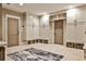 Large mud room with custom built-ins, storage baskets, tile floor, and access to exterior doors at 171 Beverly Ne Rd, Atlanta, GA 30309
