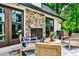 Inviting outdoor seating area with a stone fireplace, perfect for relaxing and entertaining at 171 Beverly Ne Rd, Atlanta, GA 30309
